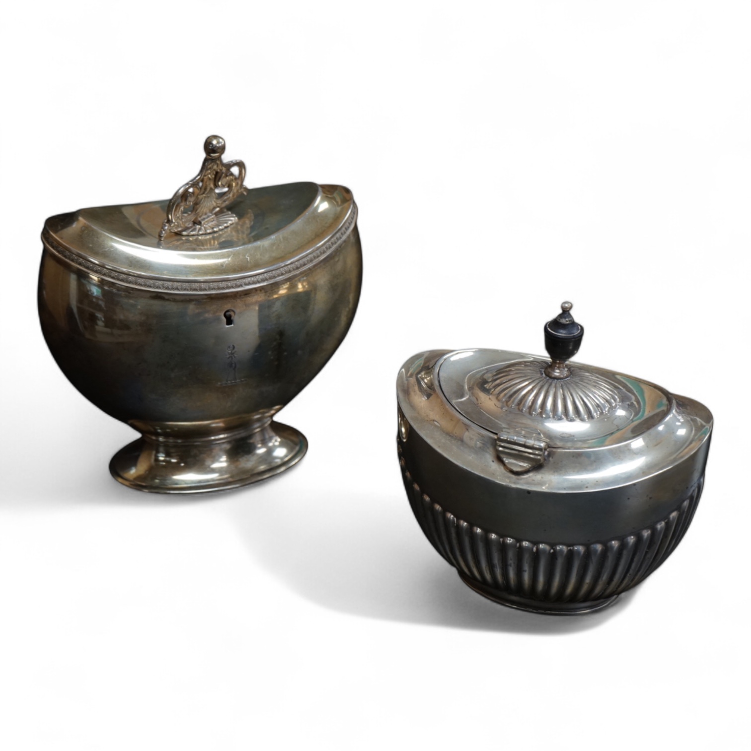 A late Victorian demi-fluted oval tea caddy, by William Hutton & Sons, London, 1894, width 11.1cm, together with a 19th century continental white metal oval tea caddy, possibly French, no key.